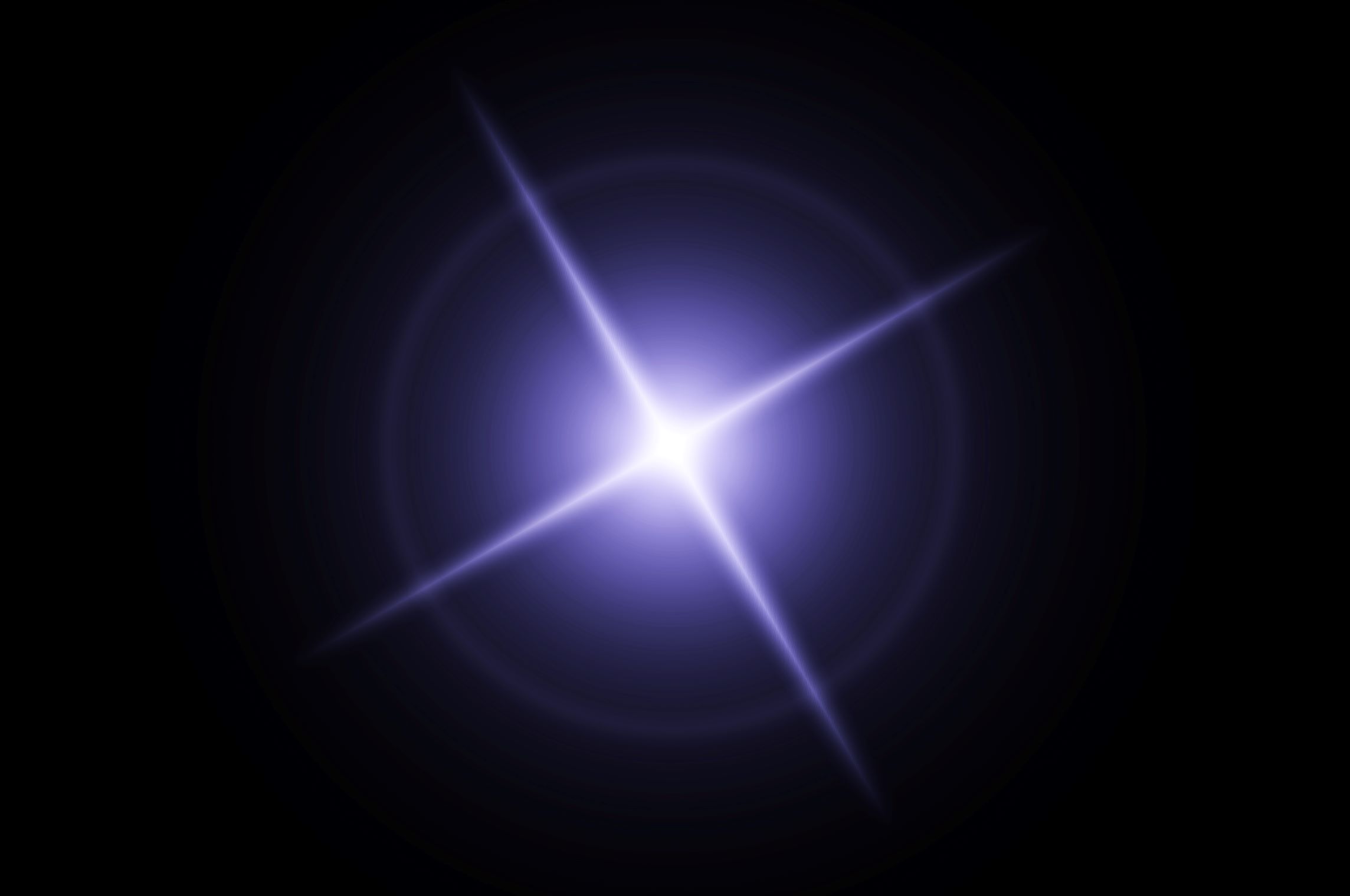 Image of a black background with bright star light in the middle